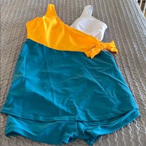2 piece dress bathing suit. Never worn.